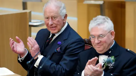 King Charles annd Kenneth Gibson clapping 