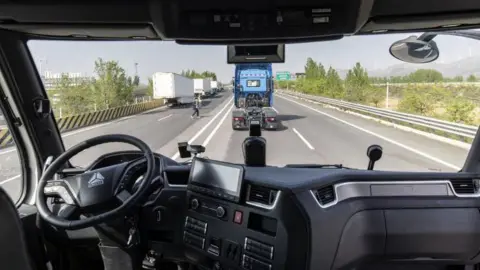 Imágenes de jetty del volante en el camión autónomo de la tecnología insepto en Xenon, provincia de Shandong, China