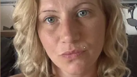 A selfie of Charlene Dowsell, who has light blonde curly hair and blue eyes