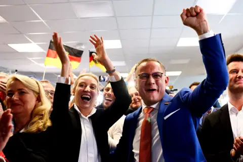 EPA Alice Weidel and Tino Chrupalla of the AfD celebrate the exit polls