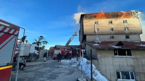 Getty Images A view of the area as firefighters respond to a fire that broke out at a hotel at the Bolu Kartalkaya Ski Center, on January 21, 2025 in Bolu, Türkiye.