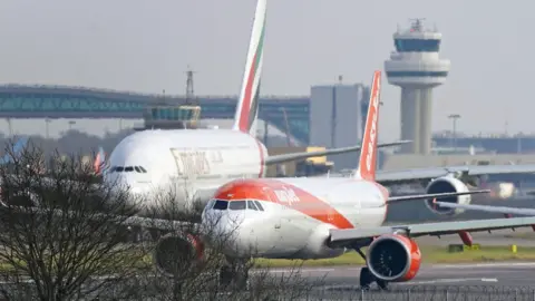 PA Media Planes queue for take off at London Gatwick Airport in Crawley, West Sussex. 