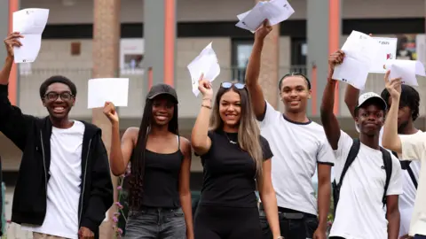 Students receive their A-level results at a school in south London
