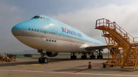 A Boeing 747 passenger aircraft, operated by Korean Air Lines, on the tarmac outside the company's hangar at Incheon International Airport