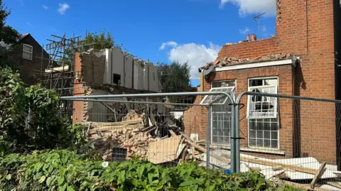 Charlotte Lillywhite The buildings at 47A, 47 and 49 Lower Mortlake Road after the collapse