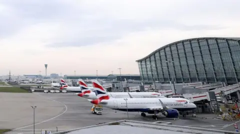 Getty Images Planes are pictured on the tarmac as passangers are refused entry to Heathrow Terminal 5