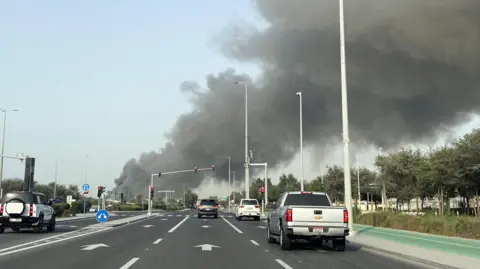 Reuters Smoke billows from Zayed port after an Iranian attack, following United States and Israel strikes on Iran, in Abu Dhabi, United Arab Emirates