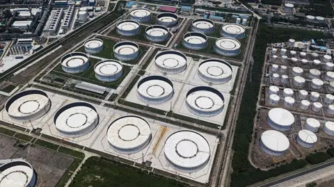 Getty Images Oil storage tanks at a petrochemical production base on the outskirts of Shanghai 