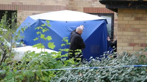 SBNA Police search a house in Milton Keynes.