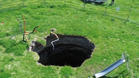 The sinkhole appeared last year on the site of a children's playground
