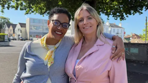 Rachel Boss is pictured on the right of the picture, she is wearing a pink blazer. Dr Jane Sedgwick Muller is wearing a grey cardigan and yellow scarf