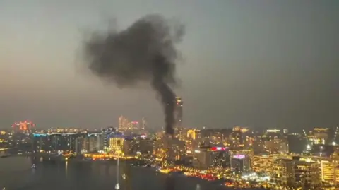 Muskaan Kataria Smoke rising into the Dubai sky after Iranian strikes