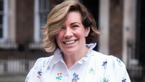 PA Clodagh Dunlop is pictured smiling