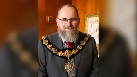 Worthing Borough Council Worthing 2023-24 mayor Jon Roser wears the badge and chains of office