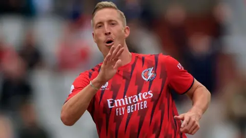 Luke Wood celebrates a wicket