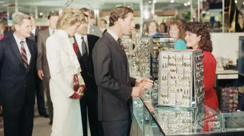 AP Charles chats with a sales clerk at a department store in Springfield, Virginia, in 1985 as his wife Princess Diana browses the jewellery