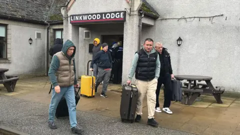 Members of the Marinera crew leaving the Linkwood Lodge Hotel in Aberdeen on Tuesday