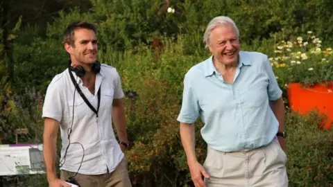 Martin Williams Martin Williams and David Attenborough share a joke on the set of a documentary.