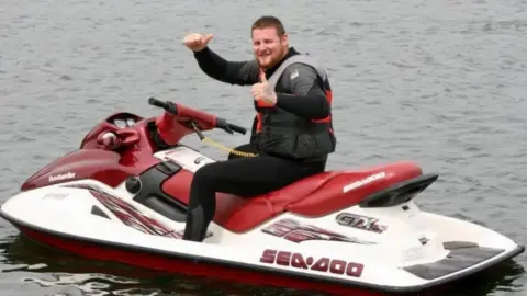 Family handout Tom Ellis on a jet ski