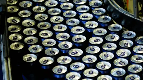 Multiple cans of drink seen from above