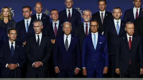Reuters Joe Biden poses with other Nato leaders in Washington at gathering