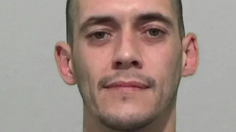 Northumbria Police Mugshot of Youssef Wynne, a man with short dark hair