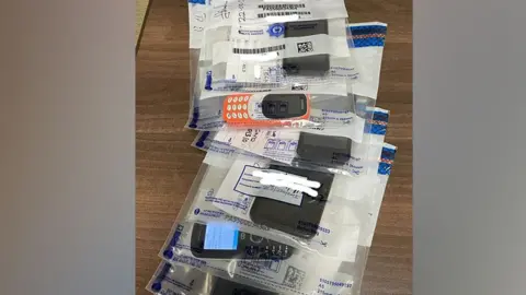 Interpol A collection of mobile phones seized by the police