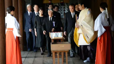 Getty Images A group of politicians visiting the Yasukuni sanctuary