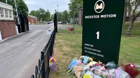 Flowers left at Bicester Motion's site.