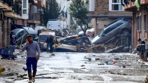 Getty Images Cars piled up on a street in Picanya, near Valencia