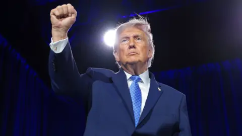  U.S. President Donald Trump pumps his fist as he leaves the stage after delivering remarks during the Faith & Freedom Coalition's 2026 Policy Conference at the Washington Hilton on June 26, 2026 in Washington, DC. 