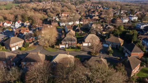 An aerial image of a large group of surburban houses