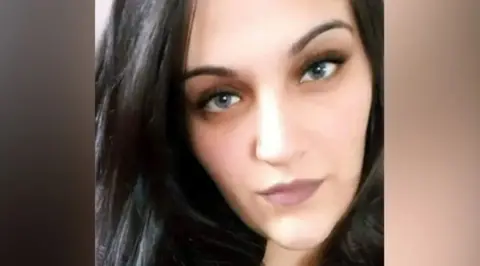 Handout Ms Espirito Santo looking at the camera with dark hair.