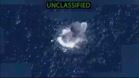 US Department of Defense Boat on fire after being hit by US forces in the Pacific.