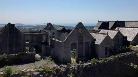 The former Carclaze school pictured after a fire left the building gutted in 2020