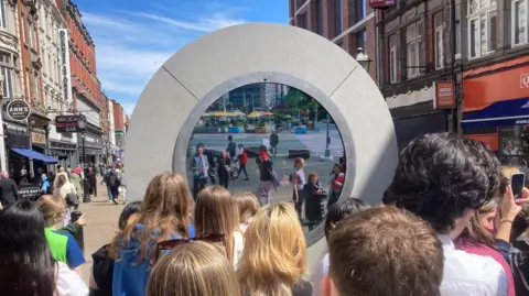 BBC People looking into the portal in Dublin