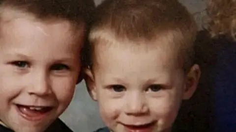 Joe McCafferty and his brother Nicky, pictured smiling in a slightly blurry photo.