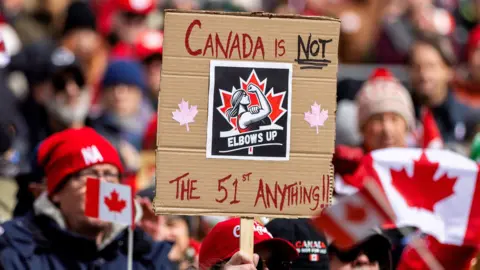 Reuters Canadians hold an "Elbows Up" protest against U.S. tariffs and other policies by U.S. President Donald Trump, at Nathan Phillips Square in Toronto, Ontario, Canada March 22, 2025.