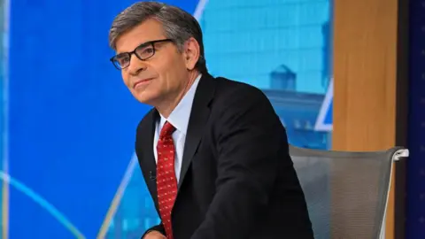 Getty Images George Stephanopoulos sits at the ABC News anchor's desk