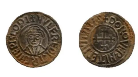 Herefordshire Council Two tarnised coins, one with an image of a man's face and the other with a stylised image of a cross, with lettering surrounding each image