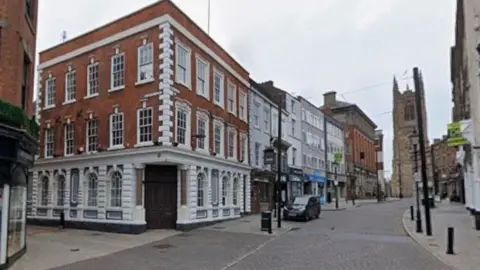 Street view of Iron Gate at the junction of Sadler Gate in Derby city centre.
