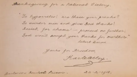 HANSONS AUCTIONEERS A picture of a brown page with handwritten writing on it. It has many words on it and a number of lines.