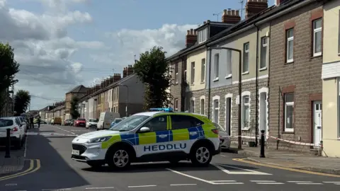 A police car parked at the entrance of Plassey Street, Penarth. 