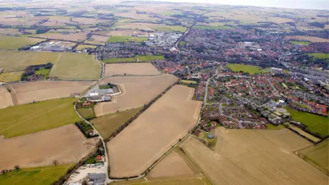 North Norfolk District Council A picture taken from a drone flying near North Walsham. The image shows the town and large fields.