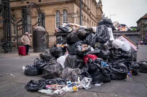 Getty Images Rubbish piled in the streets of Edinburgh