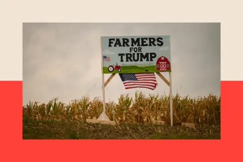 Bloomberg via Getty Images A sign saying Farmers for Trump with a US flag in a cornfield