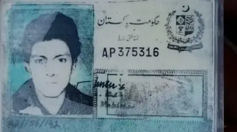 Omar Khan Identification card with blurred protrait photo and faded print