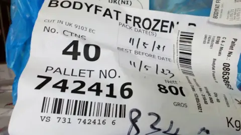 Media Wales Label with barcode in factory which reads "bodyfat frozen"