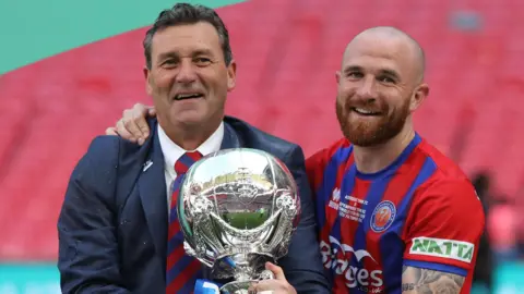 Tommy and Theo Widdrington with the FA Trophy