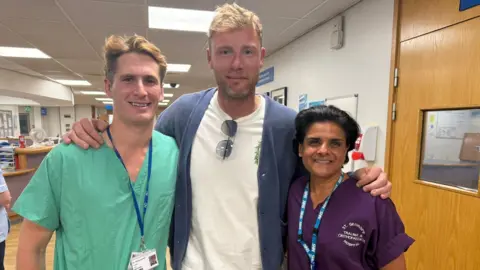 St George's University Hospitals NHS Foundation Trust/PA Wire Freddie Flintoff with St George's staff William Harland (left), registrar in Trauma and Orthopaedics and Shamim Umarji (right), Consultant Trauma and Orthopaedic Surgeon.